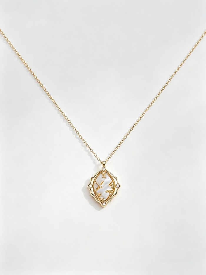 This dainty necklace features natural white mother‑of‑pearl set within gold‑toned alloy frame with seagull details. Delicate minimalist design for daily styling and thoughtful gifting for women.